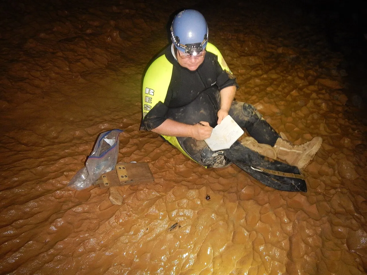 Paleontologist collecting fossil shark tooth samples in the field